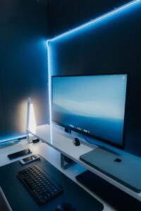 Modern RGB LED strip lights illuminating a bedroom with customizable ambient lighting for gaming, relaxation, and home décor.